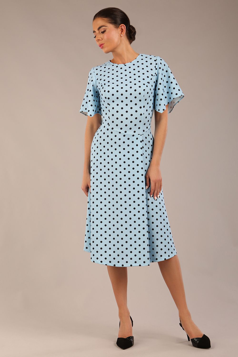 brunette model is wearing a diva catwalk Anastasia Polka Dot Bell Sleeves & A-Line Skirt Midi Dress a-line dress in sky blue polka dot front image