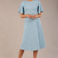 brunette model is wearing a diva catwalk Anastasia Polka Dot Bell Sleeves & A-Line Skirt Midi Dress a-line dress in sky blue polka dot front image
