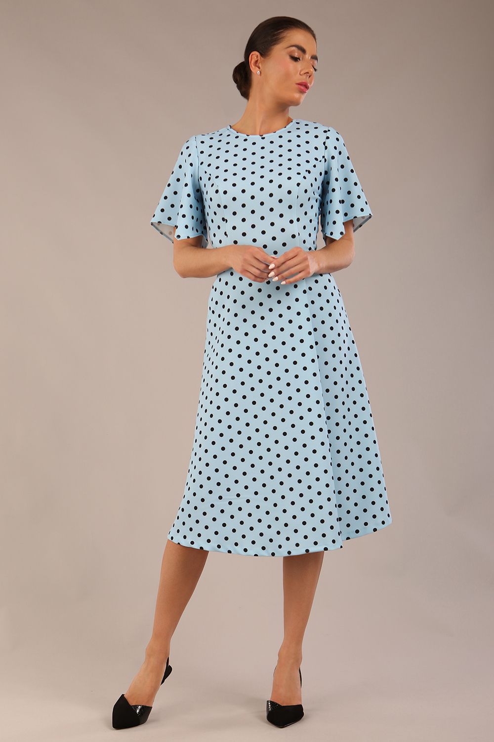 brunette model is wearing a diva catwalk Anastasia Polka Dot Bell Sleeves & A-Line Skirt Midi Dress a-line dress in sky blue polka dot front image