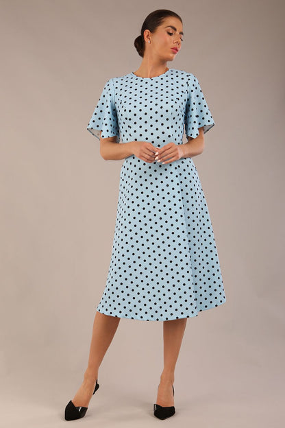 brunette model is wearing a diva catwalk Anastasia Polka Dot Bell Sleeves & A-Line Skirt Midi Dress a-line dress in sky blue polka dot front image