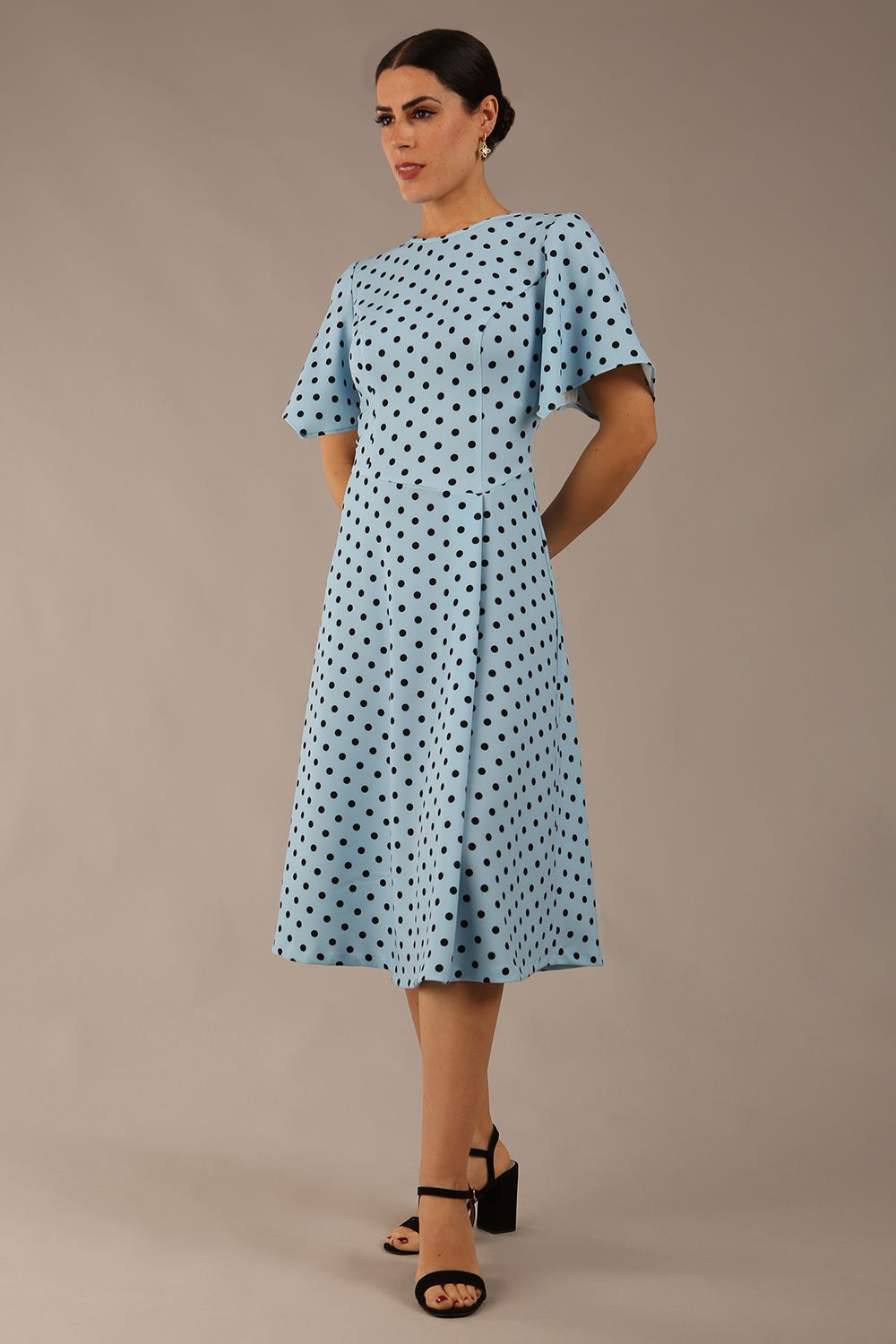 brunette model is wearing a diva catwalk Anastasia Polka Dot Bell Sleeves & A-Line Skirt Midi Dress a-line dress in sky blue polka dot front image