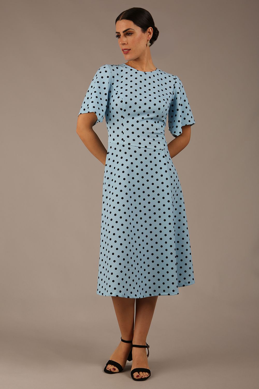 brunette model is wearing a diva catwalk Anastasia Polka Dot Bell Sleeves & A-Line Skirt Midi Dress a-line dress in sky blue polka dot front image