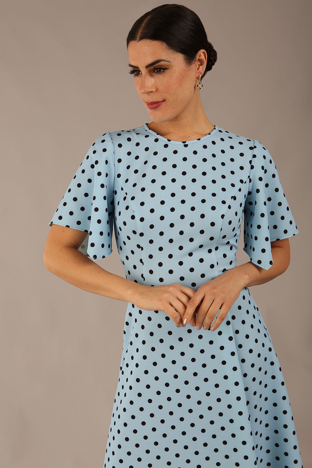brunette model is wearing a diva catwalk Anastasia Polka Dot Bell Sleeves & A-Line Skirt Midi Dress a-line dress in sky blue polka dot front image