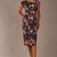 Model wearing the Nora asymmetric floral jacquard dress, showcasing the unique draped neckline (Hidcote Floral)