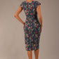 back view Model wearing the Nora asymmetric floral jacquard dress, showcasing the unique draped neckline (Navy Floral)