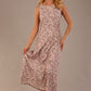 blonde model is wearing a 7000 diva catwalk Glyndebourne Sleeveless Square Neck Maxi Dress in tudor vine print with pockets front