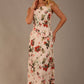 blonde model is wearing a 7000 diva catwalk Glyndebourne Sleeveless Square Neck Maxi Dress in Rose Blush print with pockets front