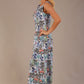 blonde model is wearing a 7000 diva catwalk Glyndebourne Sleeveless Square Neck Maxi Dress in Water Garden print with pockets front