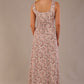 blonde model is wearing a 7000 diva catwalk Glyndebourne Sleeveless Square Neck Maxi Dress in tudor vine print with pockets back