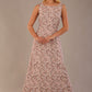 blonde model is wearing a 7000 diva catwalk Glyndebourne Sleeveless Square Neck Maxi Dress in tudor vine print with pockets front