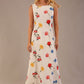 blonde model is wearing a 7000 diva catwalk Glyndebourne Sleeveless Square Neck Maxi Dress in buttercup print with pockets front