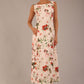 brunette model is waering a 7000 diva catwalk Glyndebourne Sleeveless Square Neck Maxi Dress in Rose Blush Print with pockets front