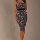 brunette model is wearing a diva catwalk June Floral Sleeveless Navy Waistband Pencil Dress in floral blue print front image