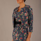 brunette model is wearing a diva catwalk June Floral Sleeveless Navy Waistband Pencil Dress in floral blue print front image with valetta jacket