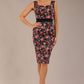 brunette model is wearing a diva catwalk June Floral Sleeveless Navy Waistband Pencil Dress in Navy Spring Rose front image