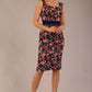brunette model is wearing a diva catwalk June Floral Sleeveless Navy Waistband Pencil Dress in Navy Spring Rose front image