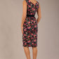brunette model is wearing a diva catwalk June Floral Sleeveless Navy Waistband Pencil Dress in Navy Spring Rose front image