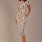 brunette model is wearing a 7002 diva catwalk Carlisle Boat Neck Short Sleeve Midi Pencil Dress in Linear Tulip print with side pockets front