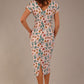 brunette model is wearing a 7002 diva catwalk Carlisle Boat Neck Short Sleeve Midi Pencil Dress in Linear Tulip print with side pockets back