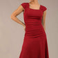 brunette model is wearing a diva catwalk Sonning Cap Sleeve Square Neckline A-Line midi Dress and rushing side details in Passion Red colour front (Passion Red)