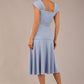 brunette model is wearing a diva catwalk Sonning Cap Sleeve Square Neckline A-Line midi Dress and rushing side details in powder blue colour back