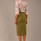 Model wearing the Rockwell 3/4 sleeve satin top in Lush Garden print, styled with an olive green pencil skirt.