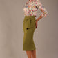 Model wearing an Oasis Green Hedy pencil skirt with a draped front and a sophisticated floral top
