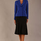 Model wearing the Melberry tailored jacket in royal blue, showing the sculpted waist and statement lapel detail.