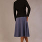 back view of the model wearing the black Melberry tailored jacket styled with the Harlow A-Line Skirt.
