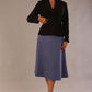 Close-up front view of the Melberry statement jacket in black, showing the flap pocket and fabric-covered buttons.