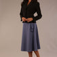 Close-up front view of the Melberry statement jacket in black, showing the flap pocket and fabric-covered buttons.