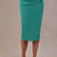 Close-up of the Claudette pencil skirt in aqua green, highlighting the side button and pleating details.