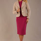 The Remy long-sleeved midi dress in festive fuchsia, showcasing the flared cuff and Classic Crepe fabric styled with the Teddy jacket