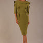 Model wearing the Rio statement collar pencil dress in oasis green, showcasing its architectural silhouette.