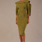 Model wearing the Rio statement collar pencil dress in oasis green, showcasing its architectural silhouette.