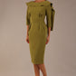 Model wearing the Rio statement collar pencil dress in oasis green, showcasing its architectural silhouette.