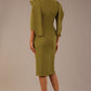 Model wearing the Rio statement collar pencil dress in oasis green, showcasing its architectural silhouette, back view