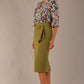 Model wearing a Suki asymmetric draped top in the Aurora Botanical print, styled with a olive green pencil skirt.
