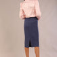 Back view of the Ingrid pencil skirt in denim blue, showing the central back vent.
