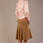 Blonde Model wearing the Shropshire top in pink, styled with a camel flared fishtail skirt