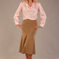 Model wearing a tanin brown Marlene fishtail skirt with a light pink top.