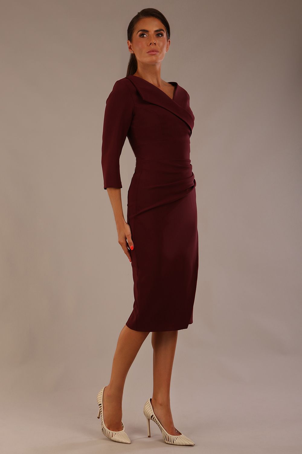 The Adley asymmetric draped pencil dress in rich burgundy red