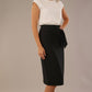 Model wearing in Black Hedy pencil skirt with a draped front and a sophisticated white top