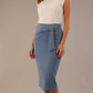Model wearing in a Blue Mineral Hedy pencil skirt with a draped front and a sophisticated white top