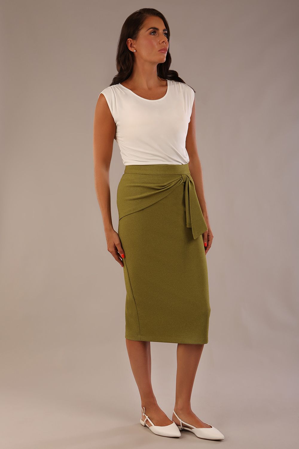 Model wearing an Oasis Green Hedy pencil skirt with a draped front and a sophisticated white top