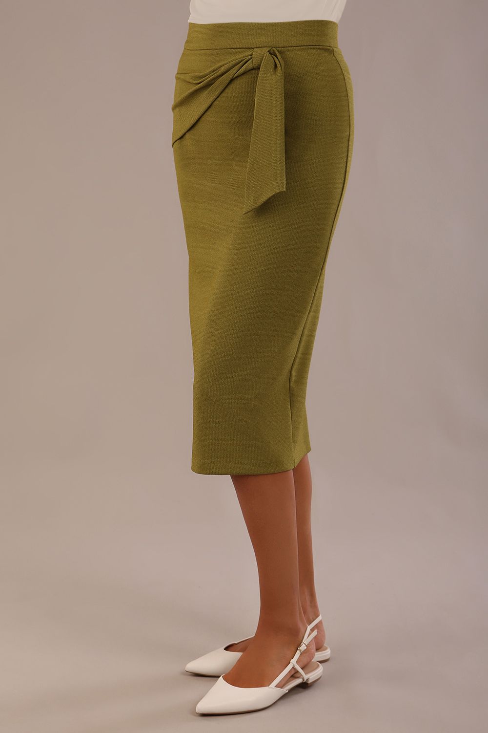 Model wearing an Oasis Green Hedy pencil skirt with a draped front 