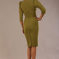 Model wearing an Ethan V-neck dress in oasis green, highlighting the flattering seams and puff shoulders back view