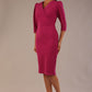 Model wearing an Ethan V-neck pencil dress in festive fuchsia, with 3/4 sleeves and puff shoulders.