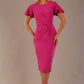 Model wearing magenta pink Finley midi pencil dress with ruched waist and split sleeves, front view.
