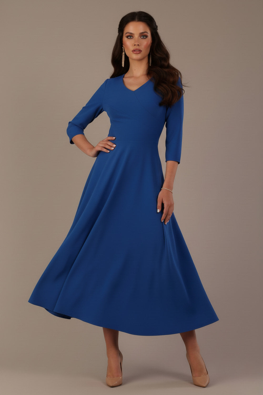 Woman wearing a blue dress against a plain background (Imperial Blue)